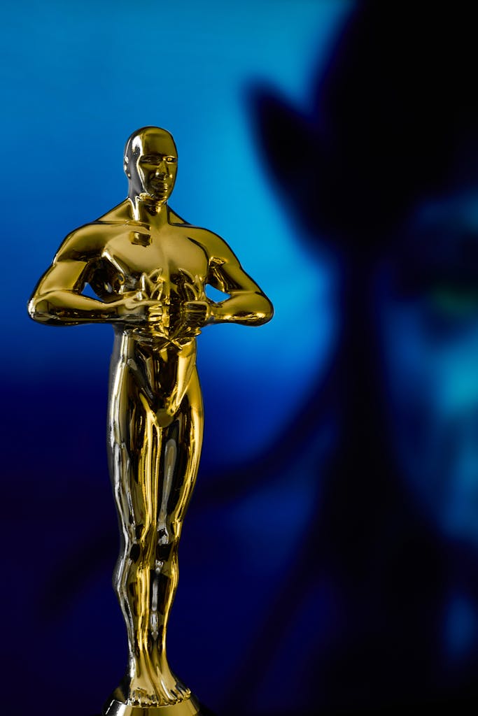Academy Award in front of blue alien character