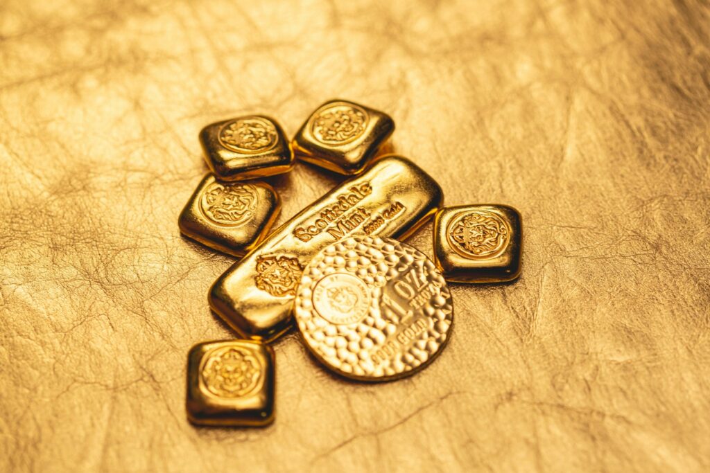a bunch of gold bars sitting on top of a table-how to store precious metals