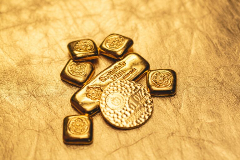 a bunch of gold bars sitting on top of a table-how to store precious metals