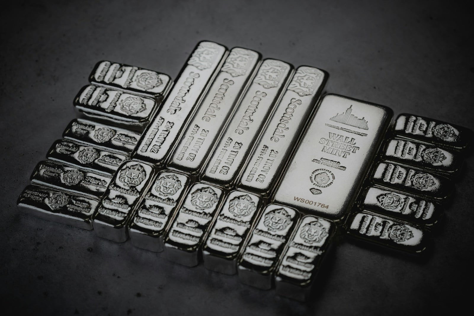 a pile of silver bars sitting on top of a table silver bar-Silver Investments